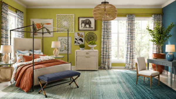 Vibrant bedroom with lime and teal walls, a four-poster bed, colorful bedding, and a woven pendant light centerpiece.